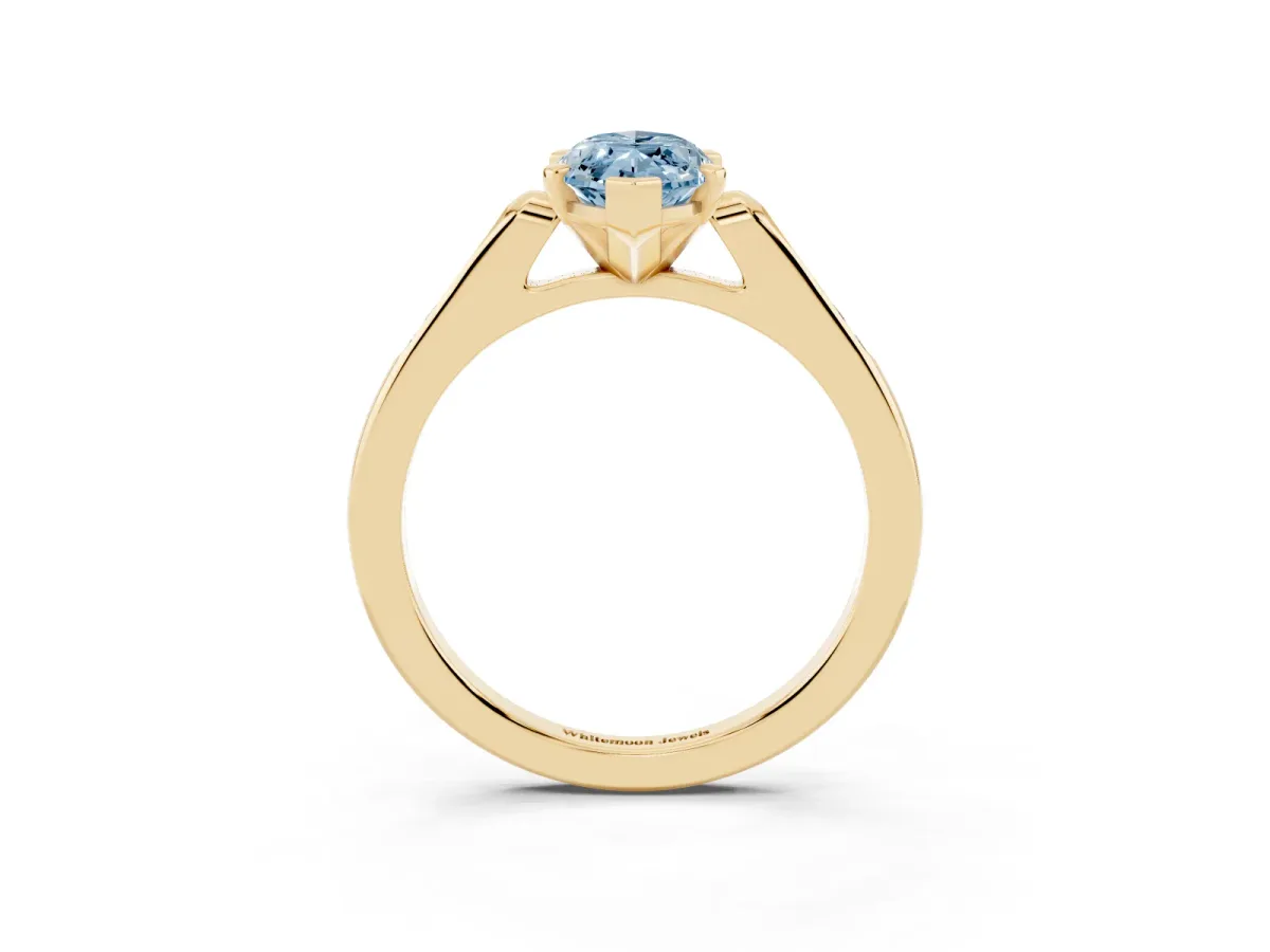 Fancy Blue Marquise Cut Diamond Solitaire Ring with Channel Set Round Band and Prong Setting Yellow gold