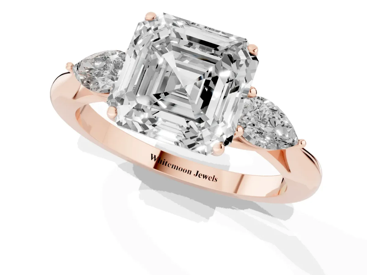 Three-Stone Asscher Cut Diamond Ring with Pear Side Stones in Four-Prong Setting Rose gold