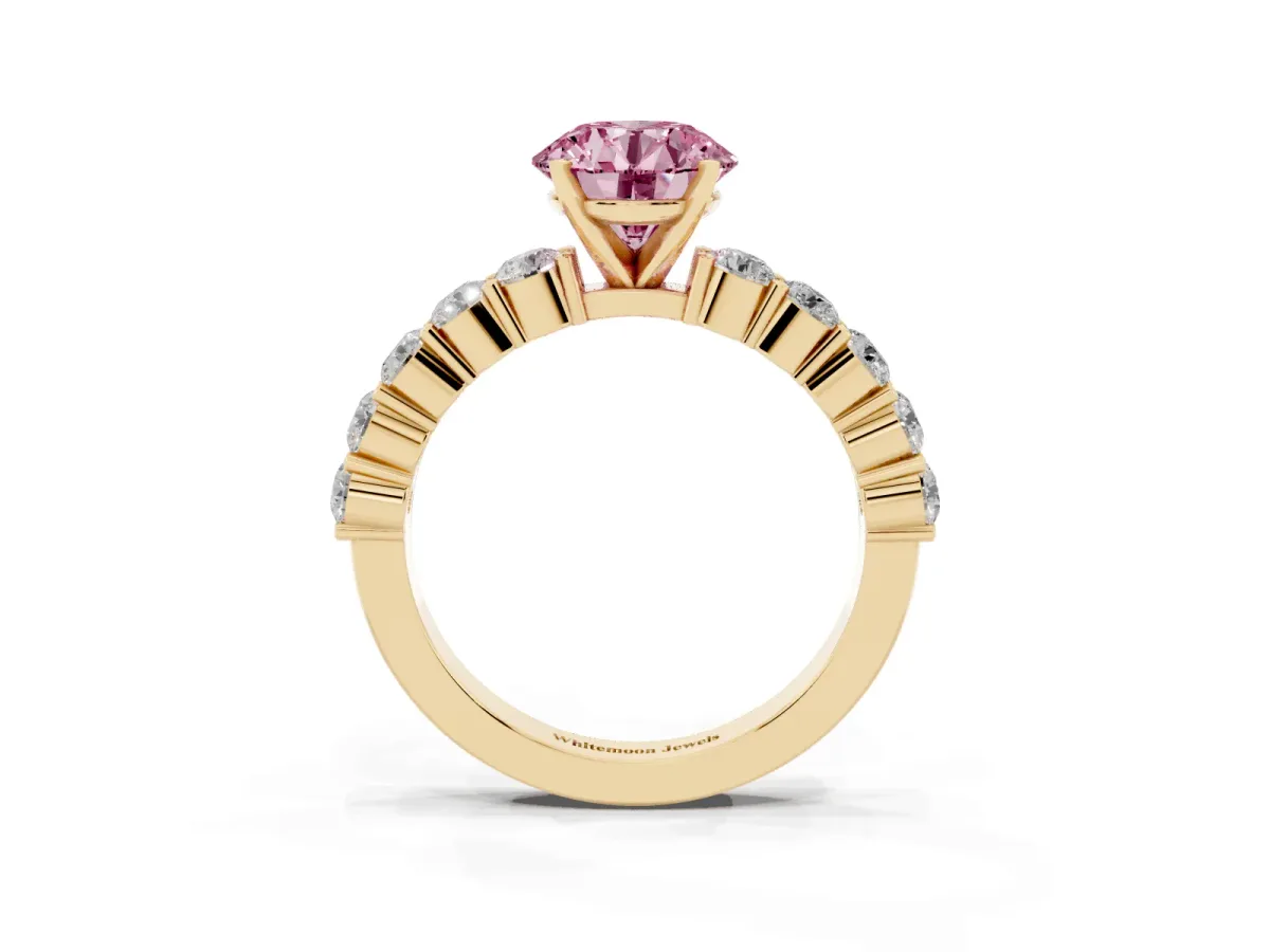 Fancy Pink Round Cut Diamond Solitaire Ring with Shared Prong Round Side Stones Yellow gold