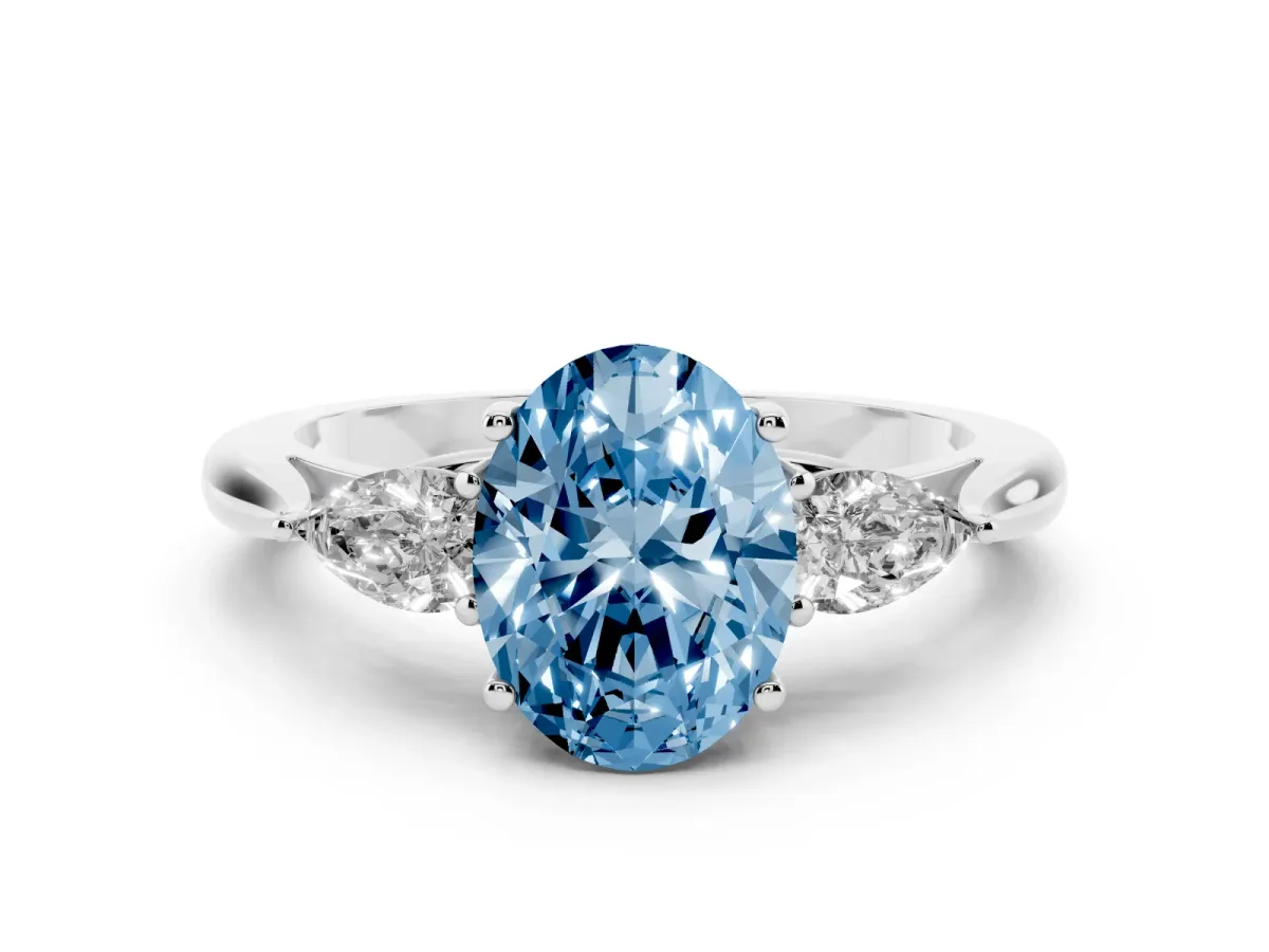 Fancy Blue Three-Stone Oval Cut Brilliant Diamond Solitaire Ring with Tapered Band and Four-Prong Setting Platinum