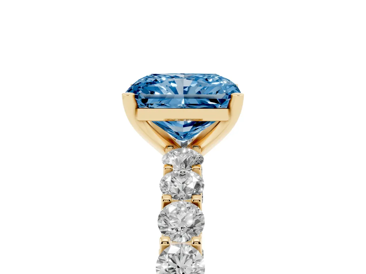 Fancy Blue Radiant Cut Diamond Solitaire Ring with Shared Prong Pavé Band and Four-Prong Setting Yellow gold