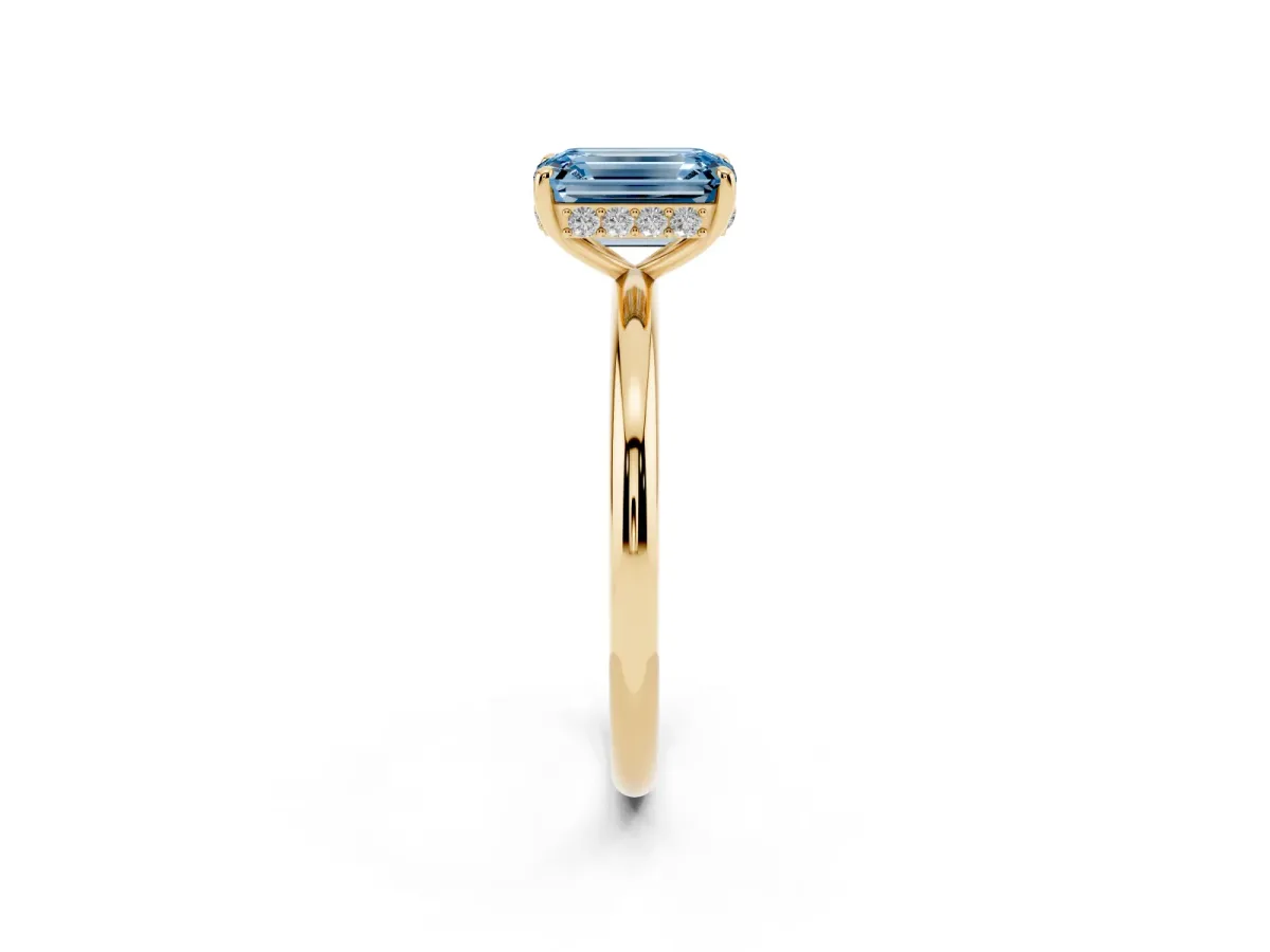 Fancy Blue Emerald Cut Solitaire Diamond Ring with a Classic Band and Four-Prong Setting Yellow gold
