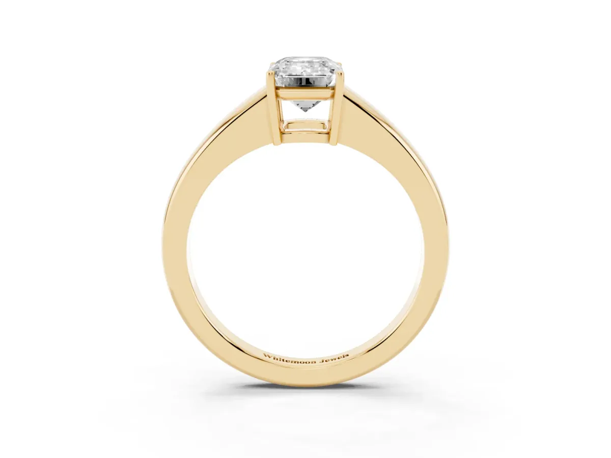 Emerald Cut Solitaire Diamond Ring with Tapered Band and Four-Prong Setting Yellow gold