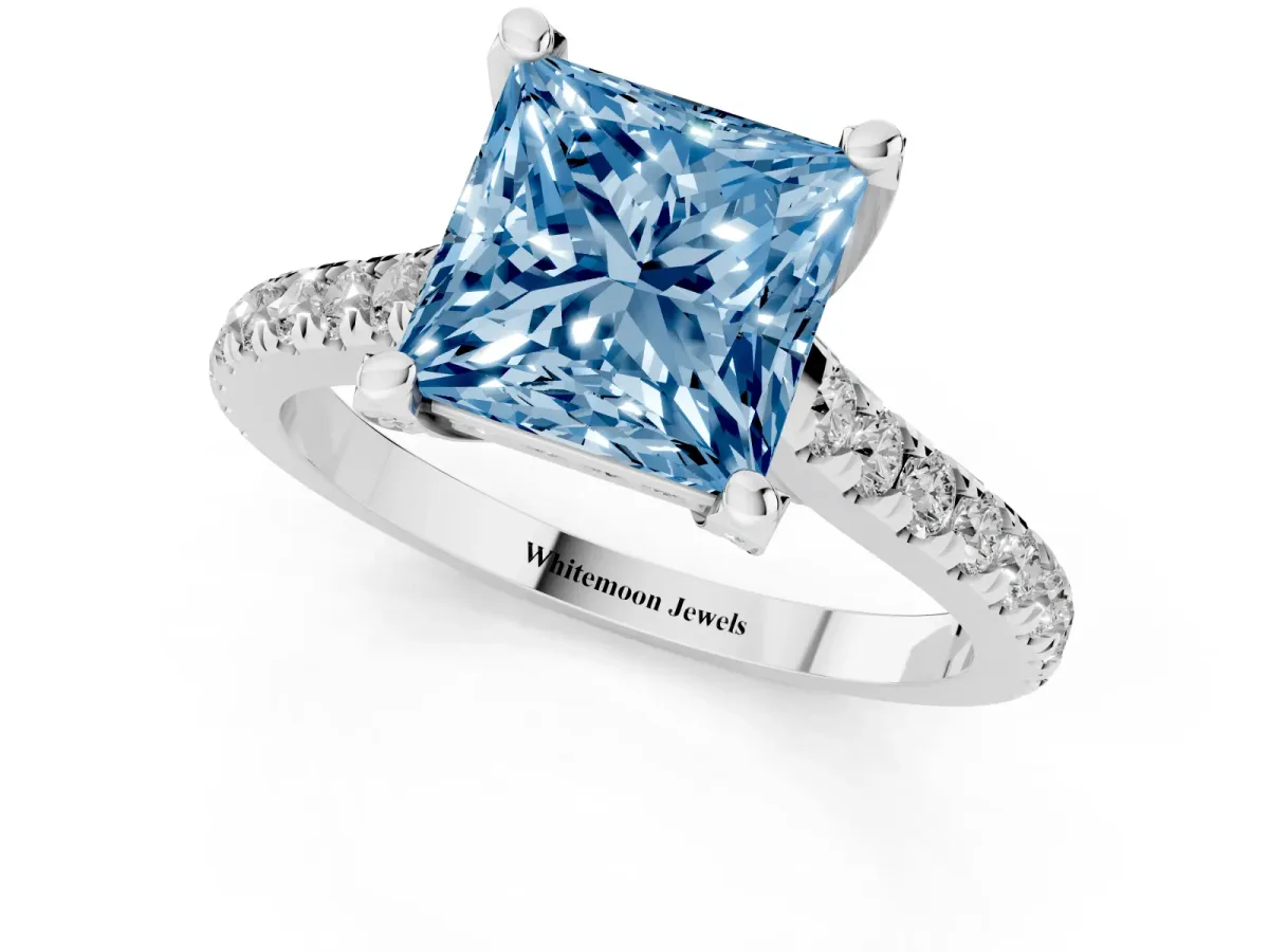 Fancy Blue Princess Cut Brilliant Diamond Solitaire with Pavé Band and Four-Prong Setting White gold