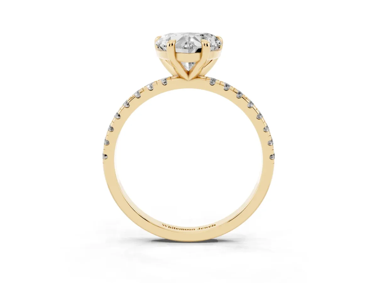 Heart Cut Diamond Brilliant Solitaire Ring with Pavé Band and Four-Prong Setting Yellow gold