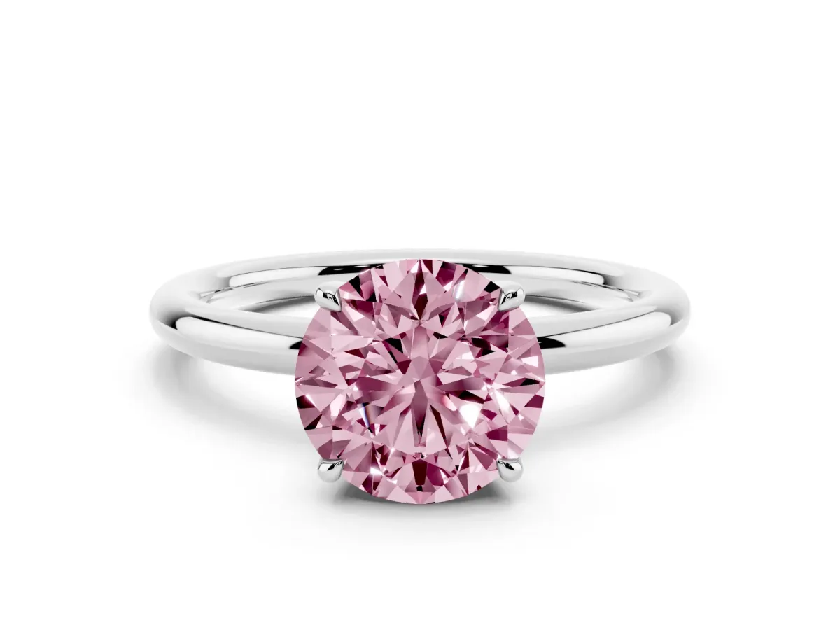 Fancy Pink Round Cut Diamond Solitaire Ring with Thin Band and Four-Prong Setting Silver