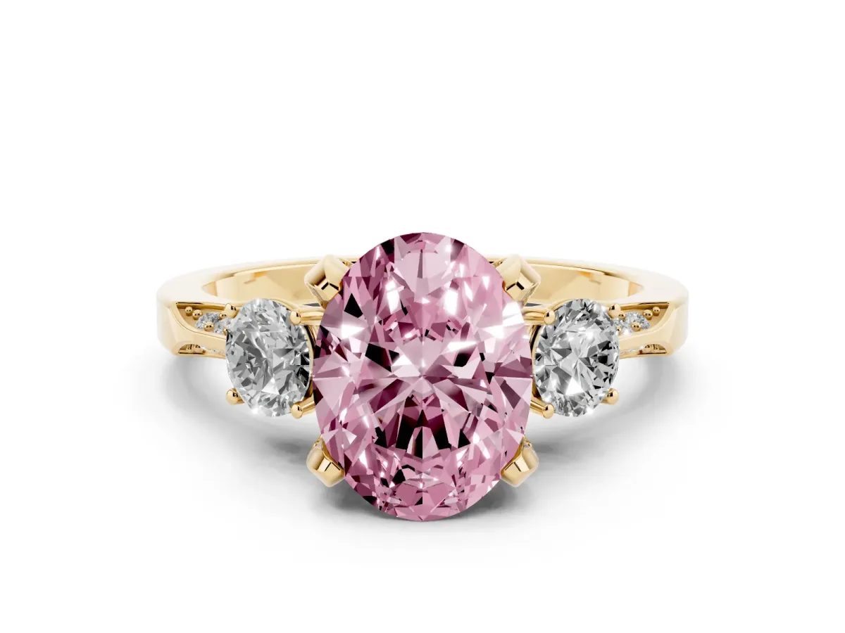 Fancy Pink Oval Cut Brilliant Three-Stone Diamond Ring with Pavé Band and Four-Prong Setting Yellow gold
