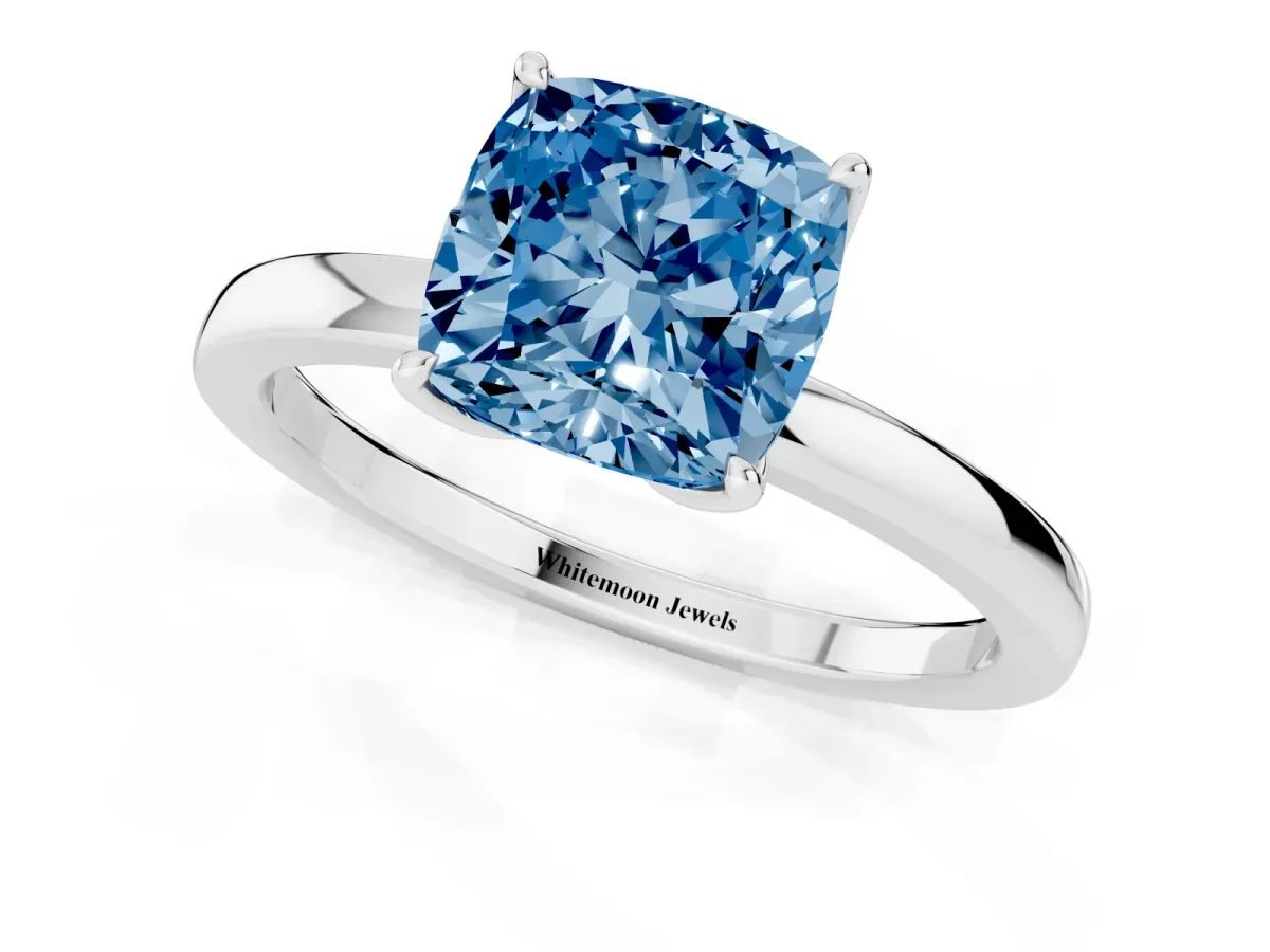 Fancy Blue Cushion Cut Diamond Solitaire Ring with Thin Band and Prong Setting Platinum