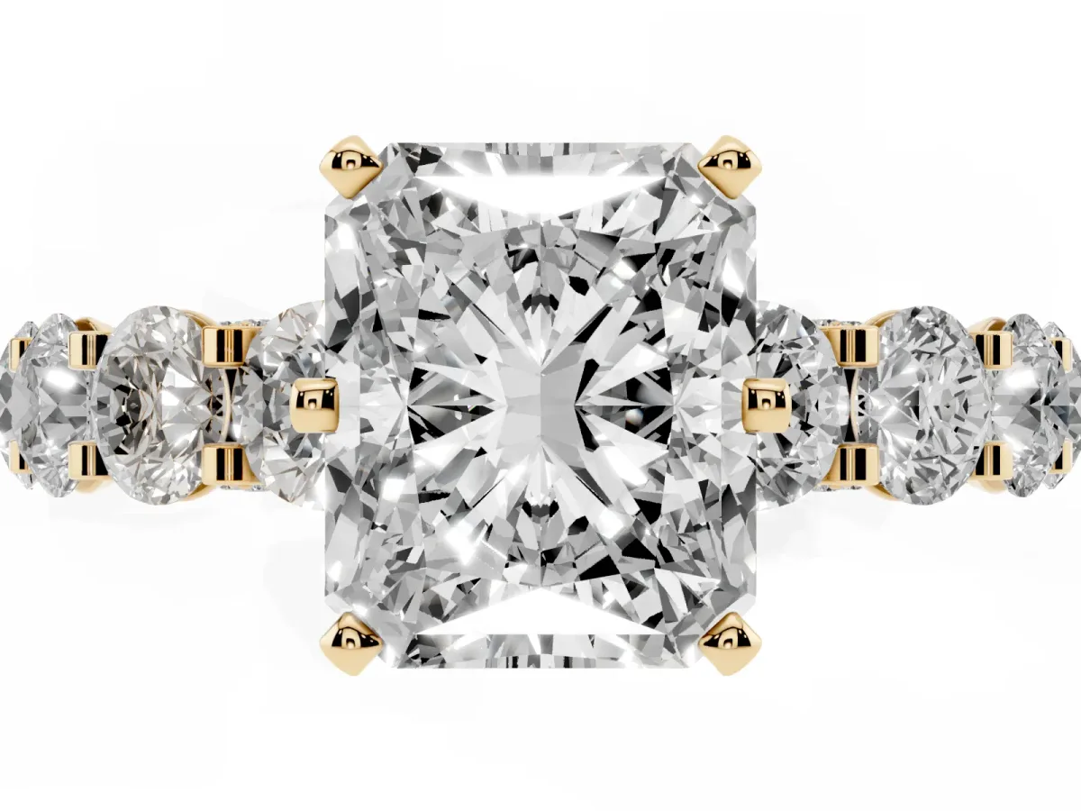 Radiant Cut Diamond Side Stone Engagement Ring with Four-Prong Setting Yellow gold