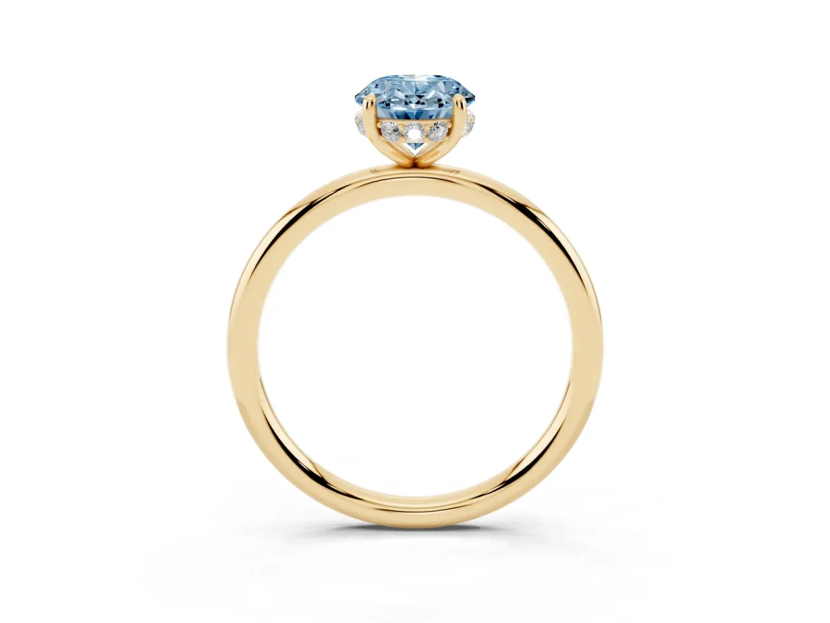 Fancy Blue Oval Cut Solitaire Diamond Ring with a Classic Band and Four-Prong Setting Yellow gold