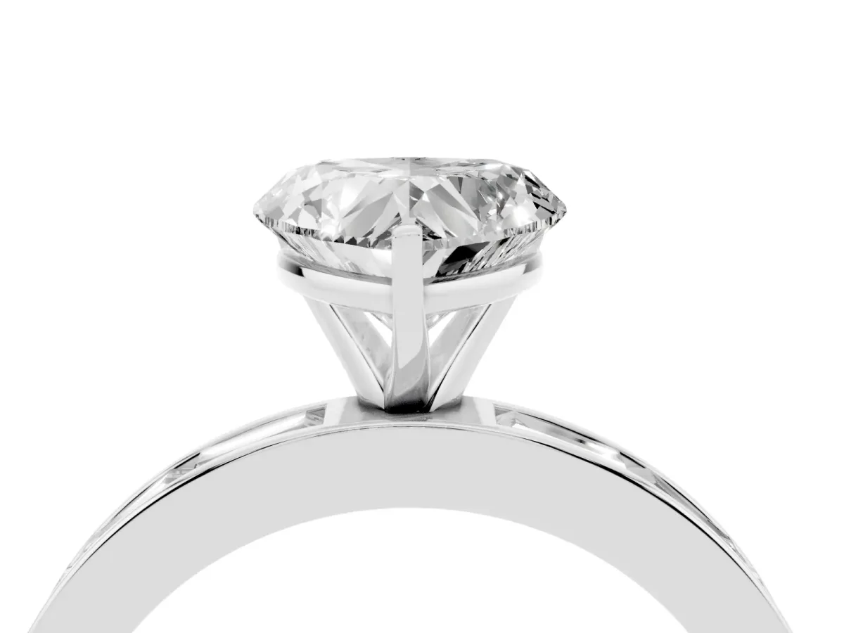 Heart Cut Solitaire Diamond Ring with Channel-Set Baguette Band and Four-Prong Setting Platinum