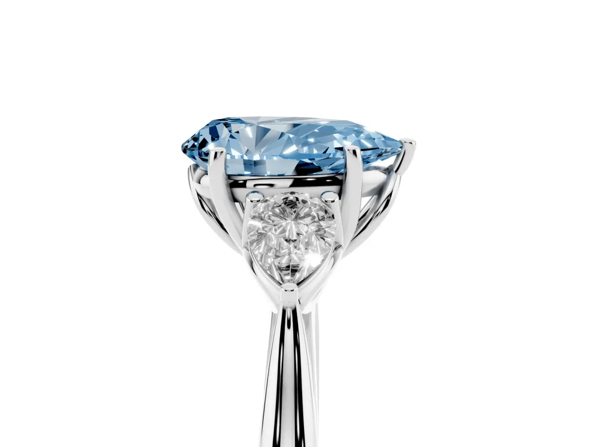 Fancy Blue Three-Stone Pear Cut Brilliant Diamond Solitaire Ring with Tapered Band and Four-Prong Setting White gold