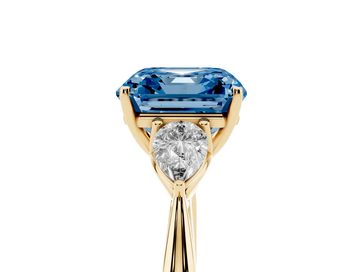 Fancy Blue Asscher Cut Diamond Three-Stone Ring with Pear Side Stones and Prong Setting Yellow gold