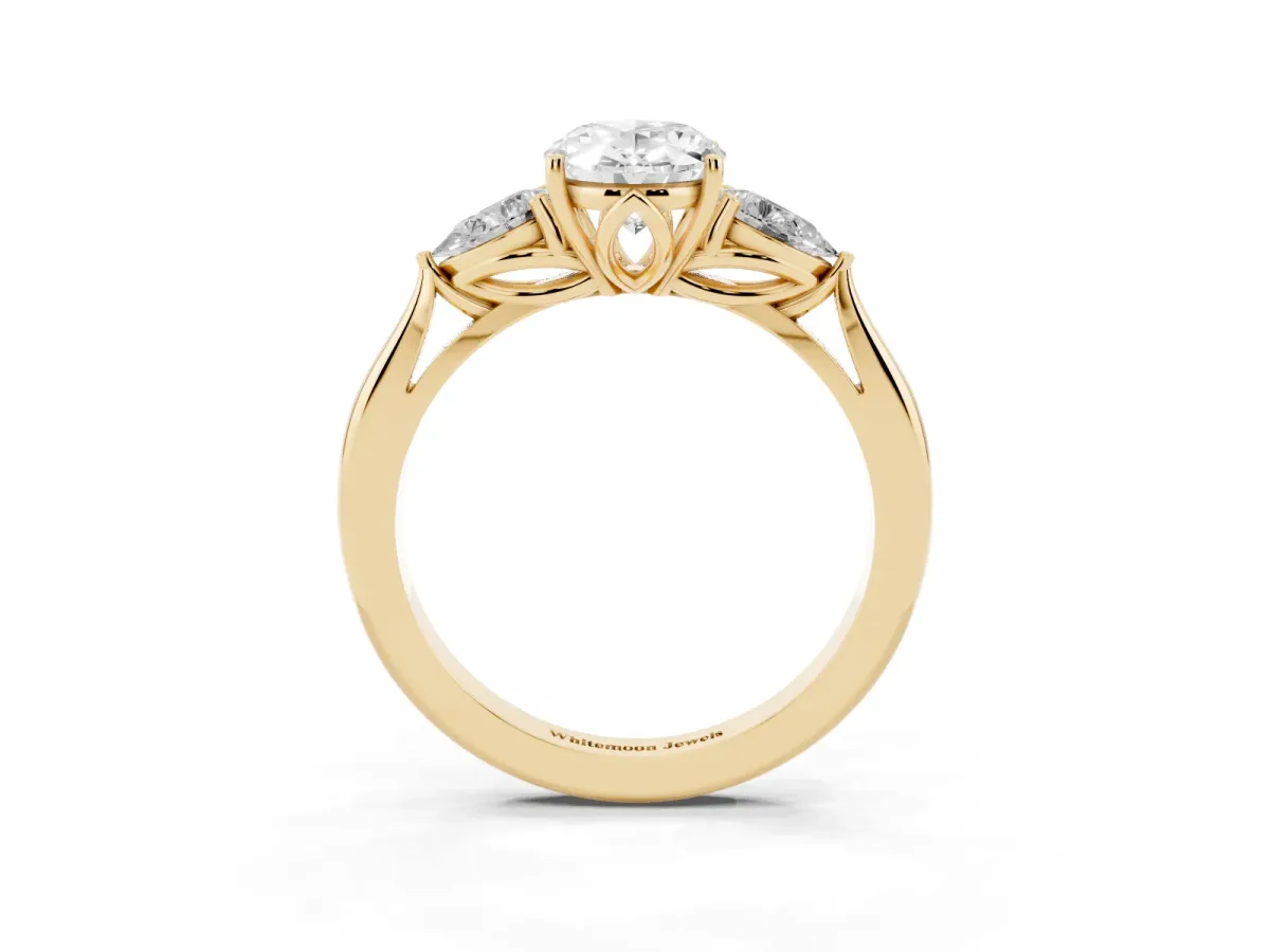Three-Stone Oval Cut Brilliant Diamond Solitaire Ring with Tapered Band and Four-Prong Setting Yellow gold