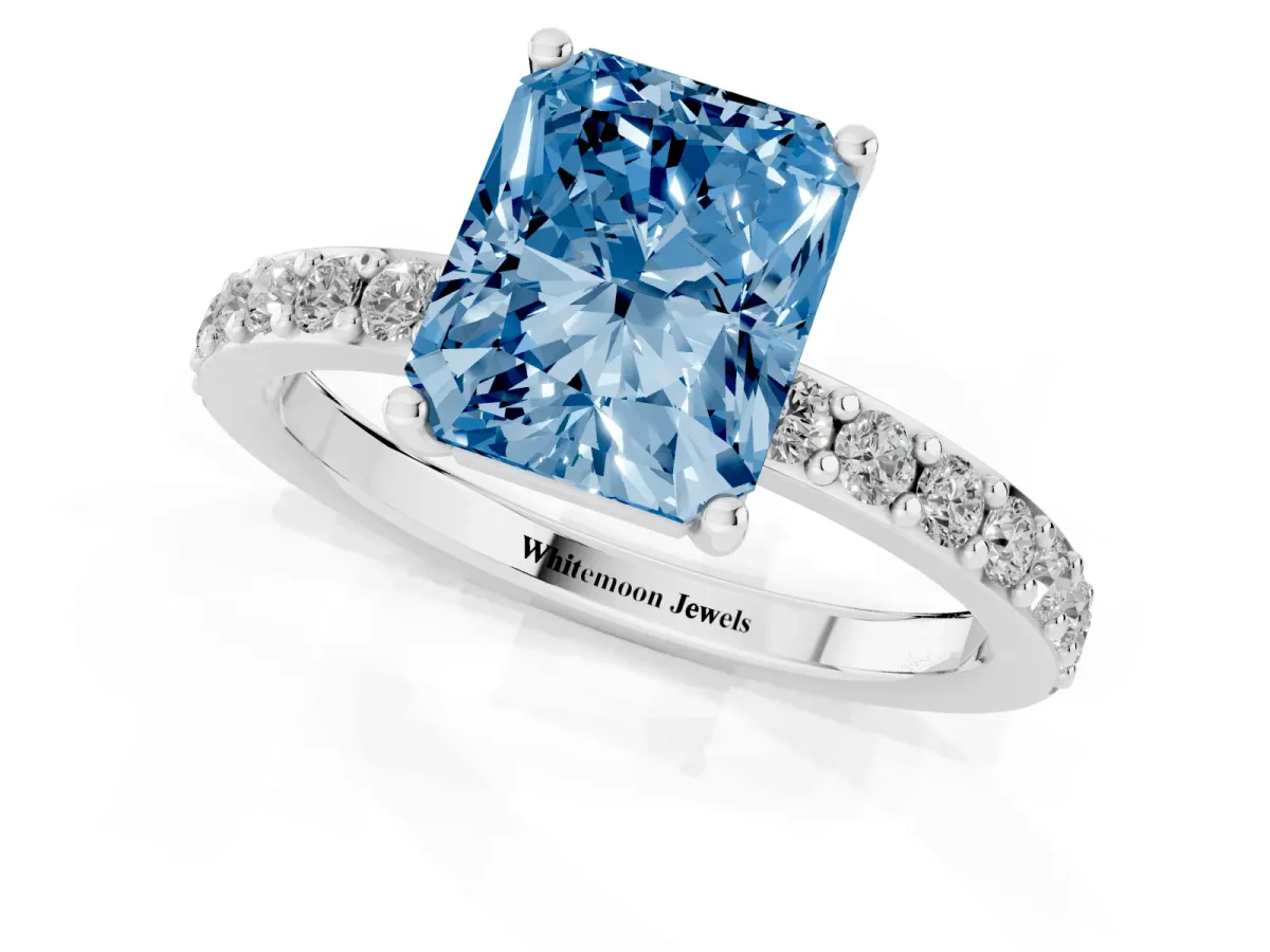 Fancy Blue Radiant Cut Cut Diamond Solitaire with Pave Band and Four-Prong Setting Silver
