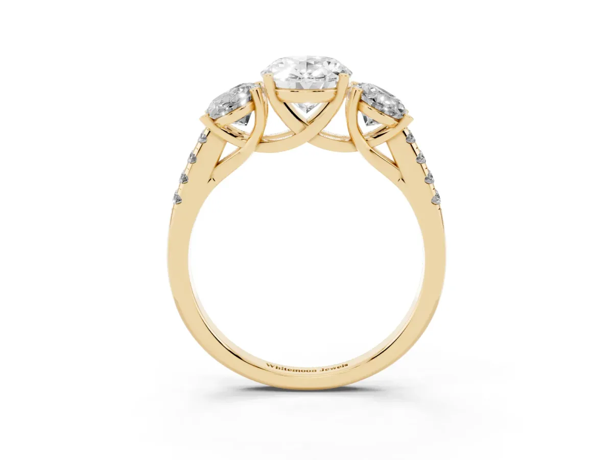 Three-Stone Oval Cut Diamond Ring with Round Pavé Band and Prong Setting Yellow gold