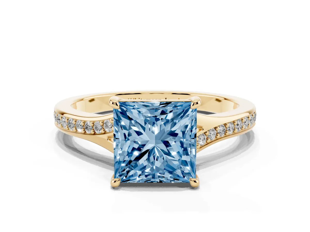 Fancy Blue Princess Cut Diamond Solitaire Ring with Pavé Band and Prong Setting Yellow gold