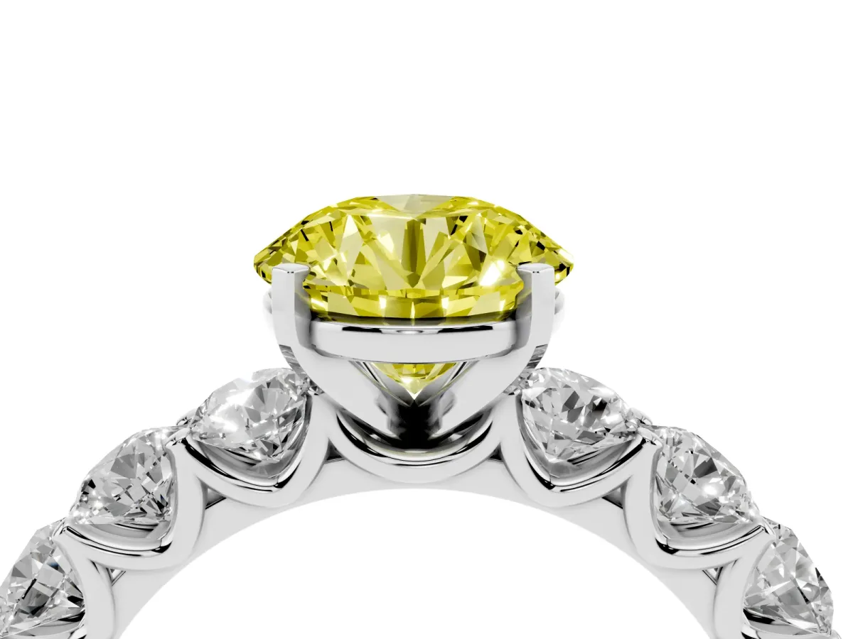 Fancy Yellow Round Cut Diamond Prong Setting with Side Stones on a Pave Band Platinum