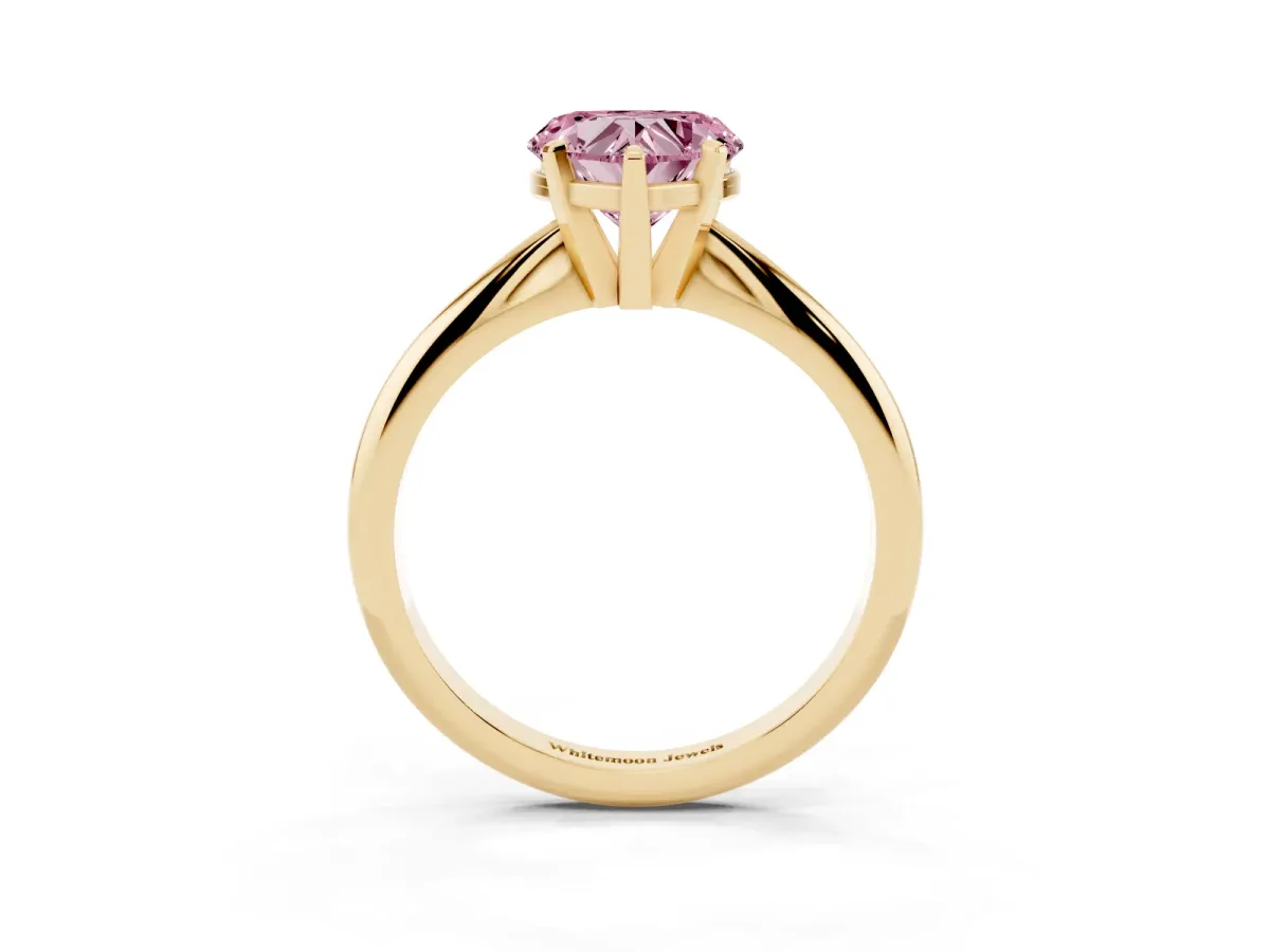 Fancy Pink Heart Cut Cut Solitaire Ring with Four-Prong Setting on a Classic Band Yellow gold