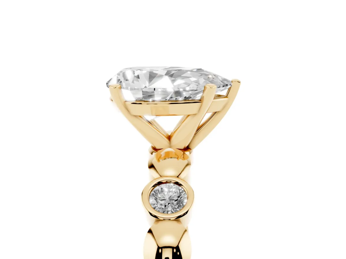 Pear Cut Solitaire Bezel-Set Diamond Ring with Beaded Band and Four-Prong Setting Yellow gold