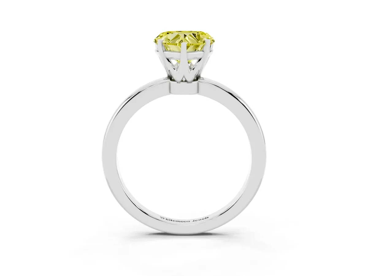 Fancy Yellow Heart Cut Solitaire Diamond Ring with Six-Prong Setting on a Classic Band Silver