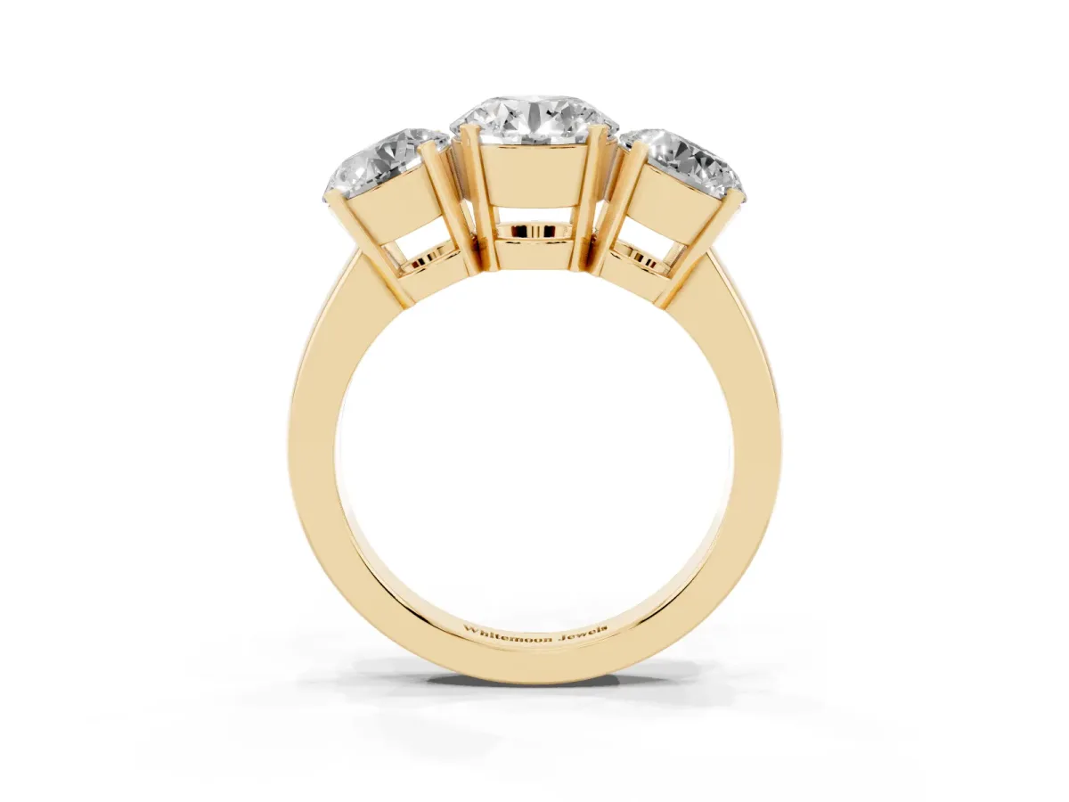 Three-Stone Round Cut Cut Diamond Ring with Channel Set Band and Four-Prong Setting Yellow gold
