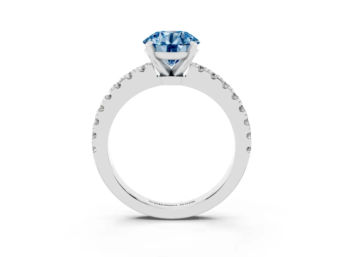 Fancy Blue Round Cut Solitaire Diamond with Pavé Band and Four-Prong Setting Silver