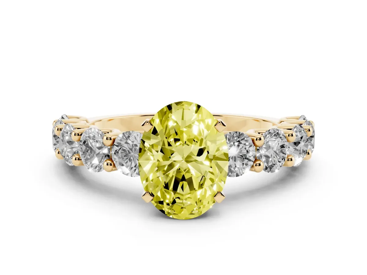 Fancy Yellow Oval Cut Diamond Prong Setting with Side Stones on a Pave Band Yellow gold