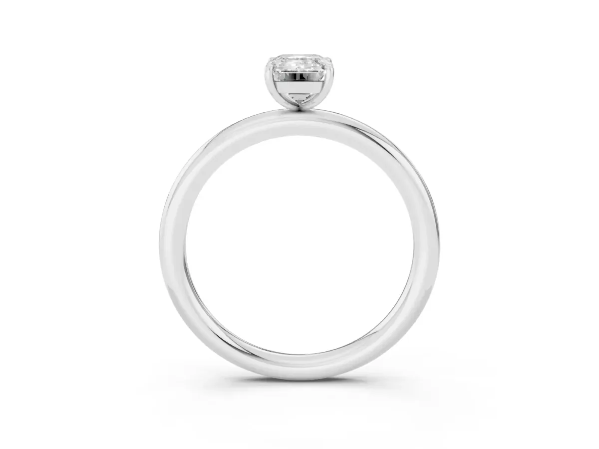 Emerald Cut Solitaire Diamond Ring with Four-Prong Setting on a Plain Band Platinum