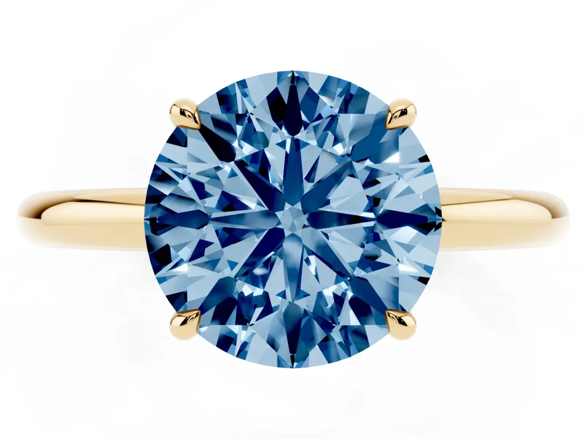 Fancy Blue Round Cut Diamond Solitaire Ring with Thin Band and Four-Prong Setting Yellow gold