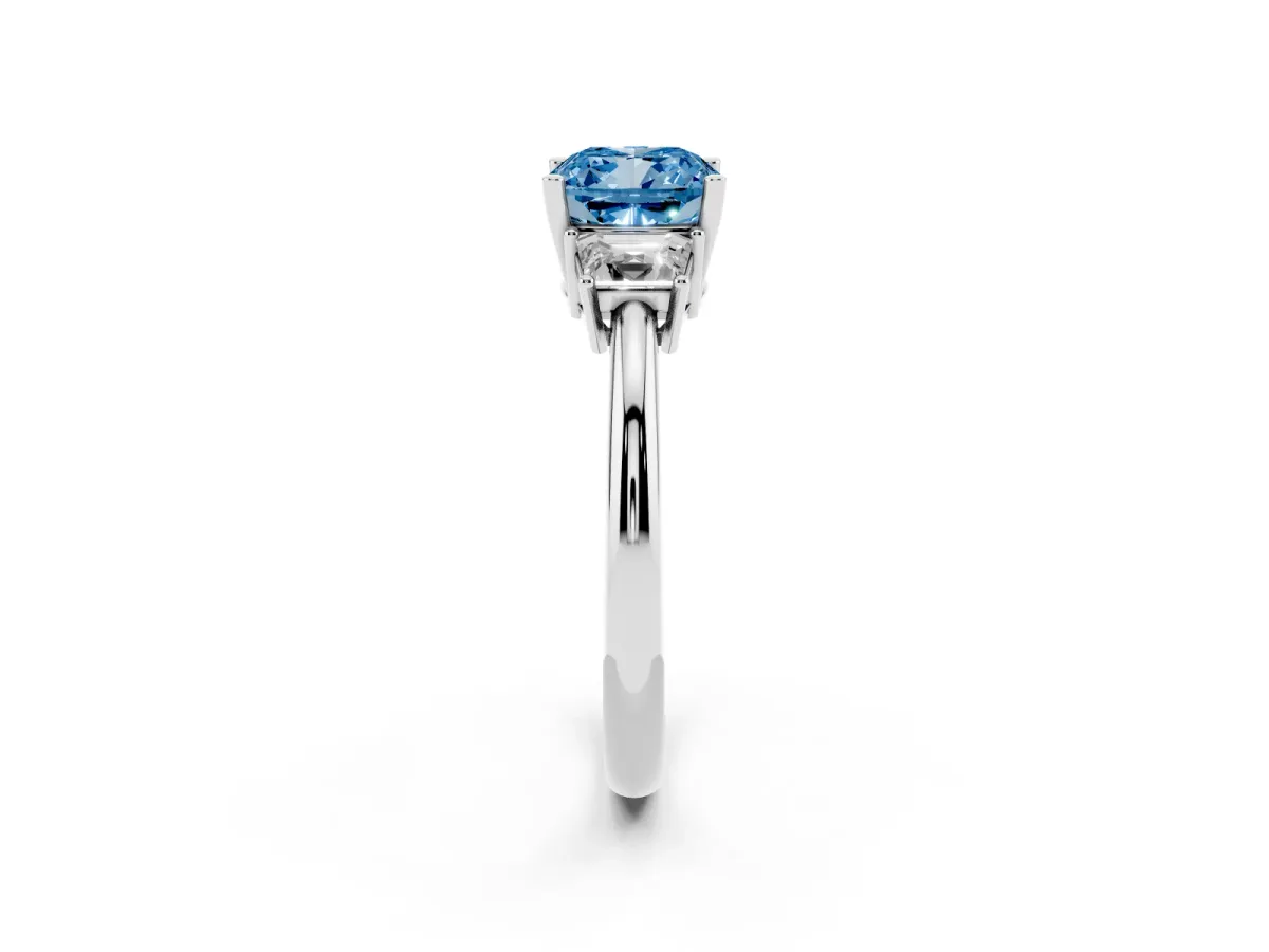 Fancy Blue Cushion Cut Diamond Three-Stone Ring with Trapezoid Side Stones and Prong Setting Platinum