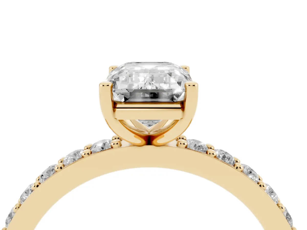Emerald Cut Cut Diamond Solitaire with Pave Band and Four-Prong Setting Yellow gold