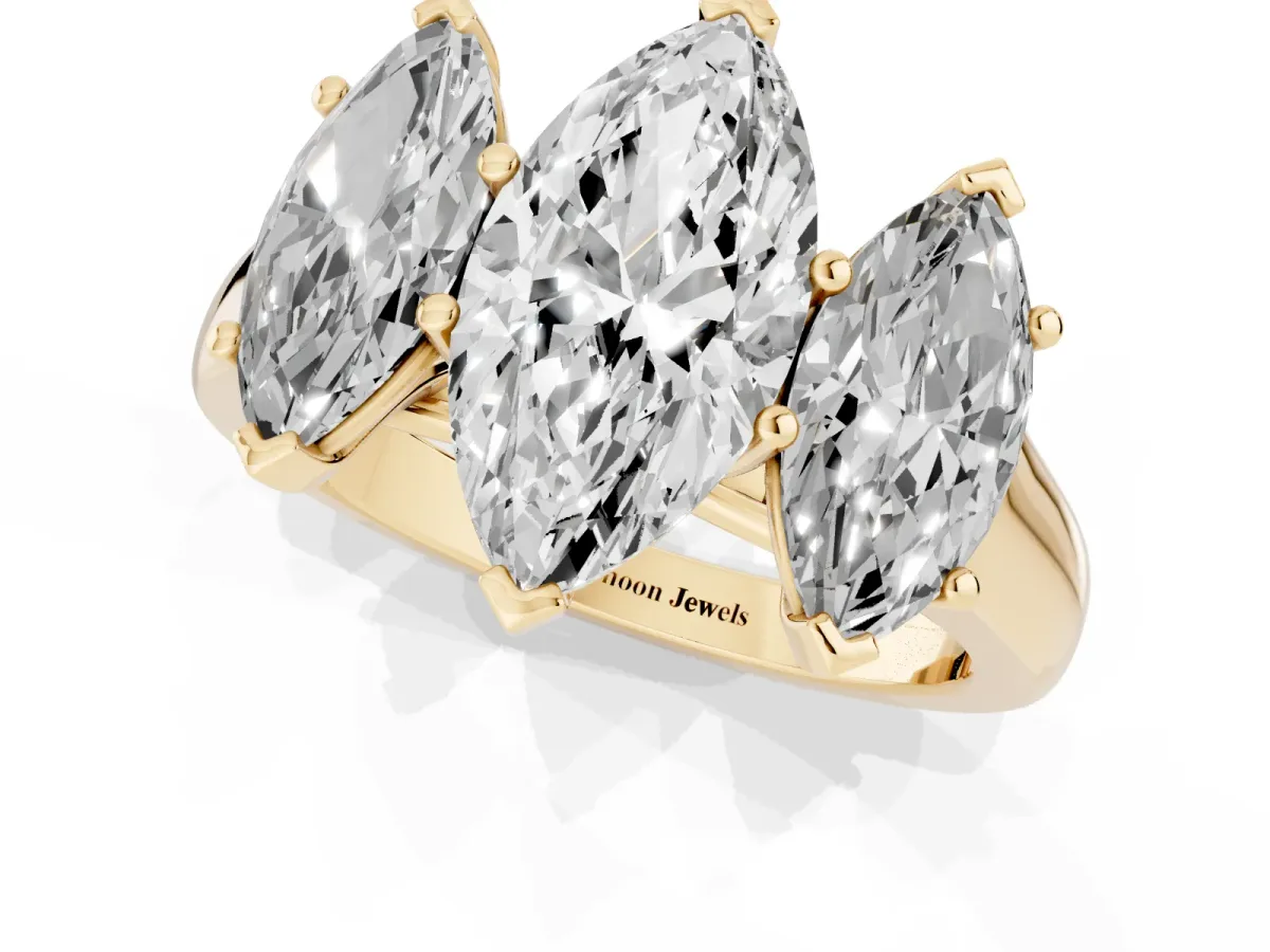 Marquise Cut Three-Stone Diamond Ring with Prong Setting on a Classic Band Yellow gold