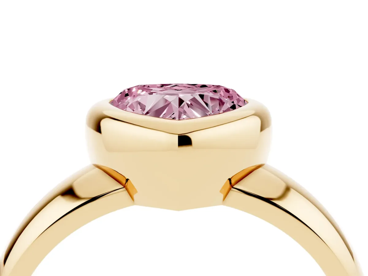 Fancy Pink Bezel Set Heart Cut Solitaire Ring with Wide Band Yellow gold