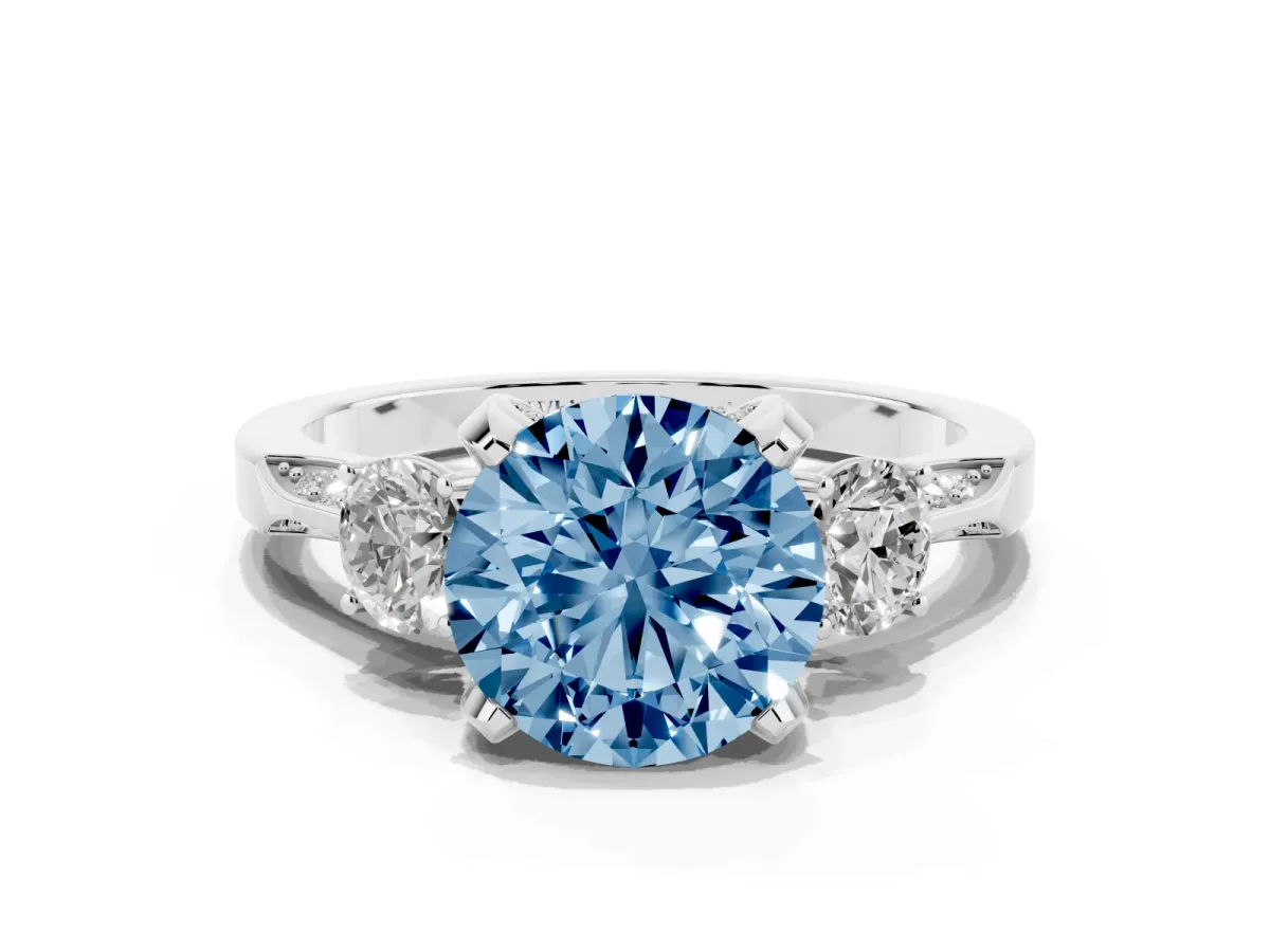 Fancy Blue Round Cut Brilliant Three-Stone Diamond Ring with Pavé Band and Four-Prong Setting Silver