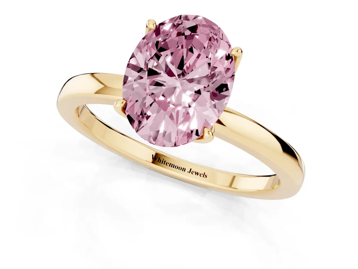 Fancy Pink Oval Cut Diamond Solitaire Ring with Thin Band and Prong Setting Yellow gold