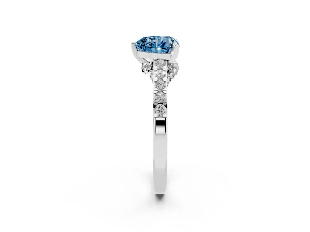 Fancy Blue Heart Cut Diamond Solitaire Ring with Crossover Gallery and Round Pavé Band Platinum
