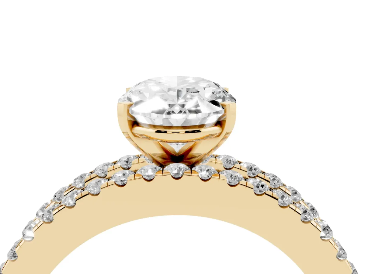 Oval Cut Diamond Solitaire Ring with Pavé and Channel Set Band Yellow gold
