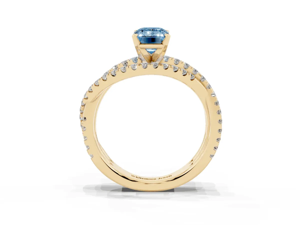 Fancy Blue Emerald Cut Solitaire Twist Band with Pavé Setting and Four-Prong Setting Yellow gold