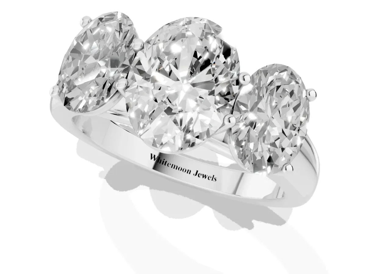 Oval Cut Three-Stone Diamond Ring with Prong Setting on a Classic Band Silver