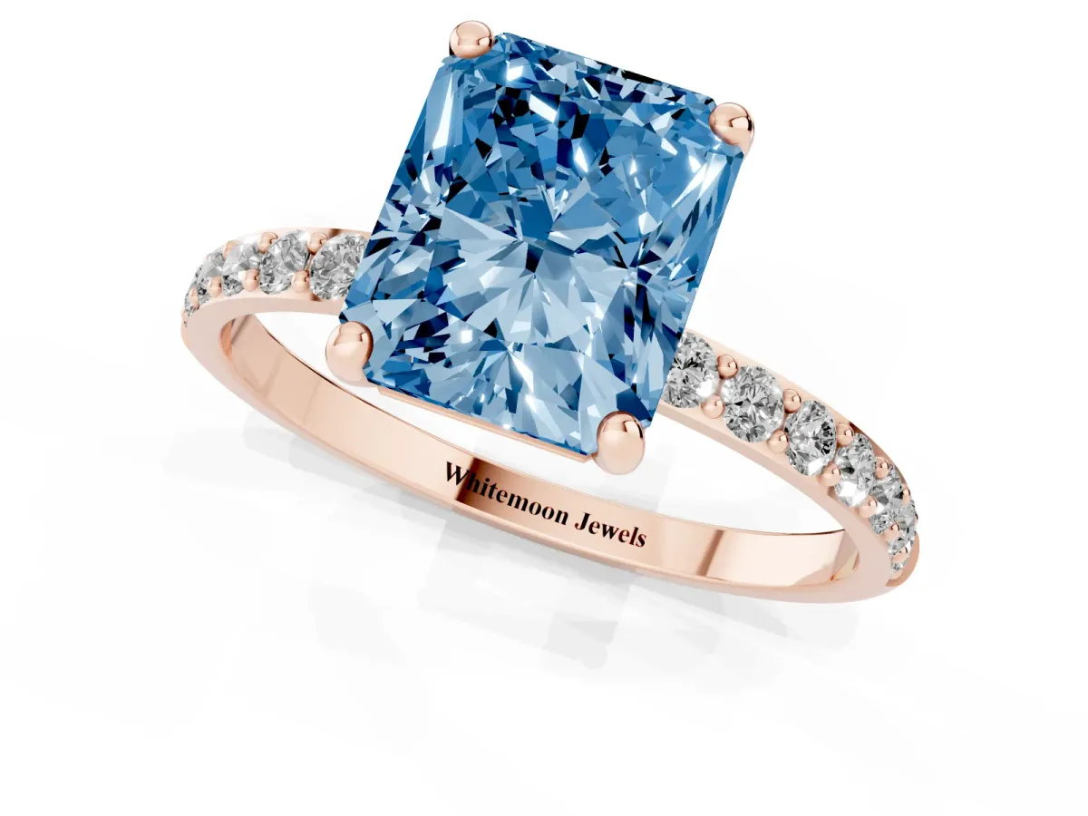 Fancy Blue Radiant Cut Diamond Solitaire Ring with Round Pavé Band and Prong Setting Rose gold