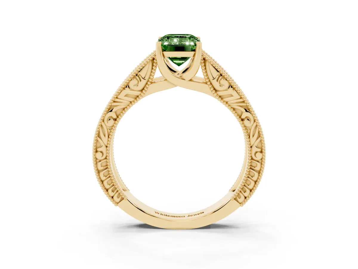 Fancy Green Emerald Cut Diamond Solitaire Ring with Engraved Band and Four-Prong Setting Yellow gold