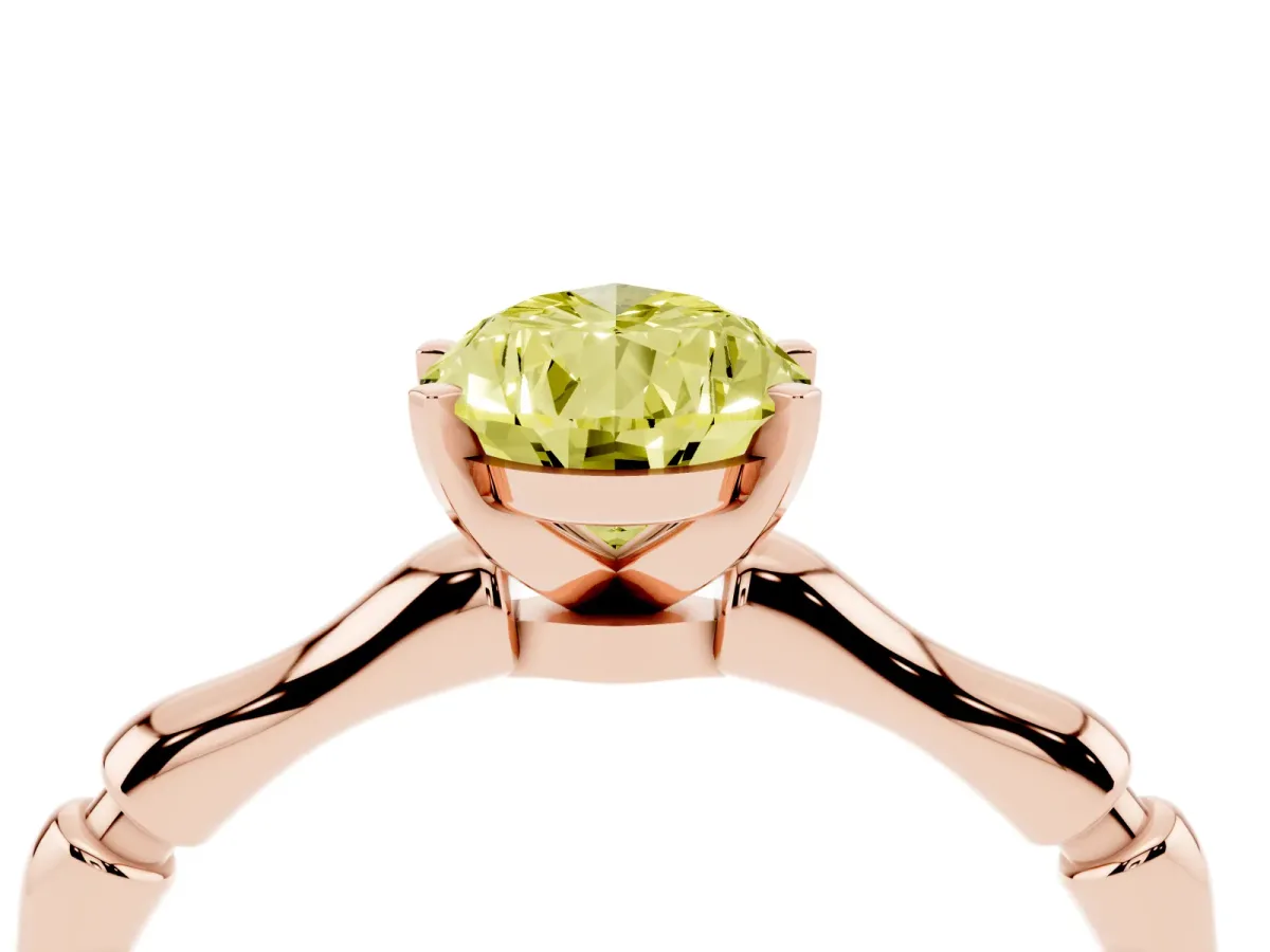 Fancy Yellow Pear Cut Solitaire Diamond Ring with Bamboo Band and Four-Prong Setting Rose gold