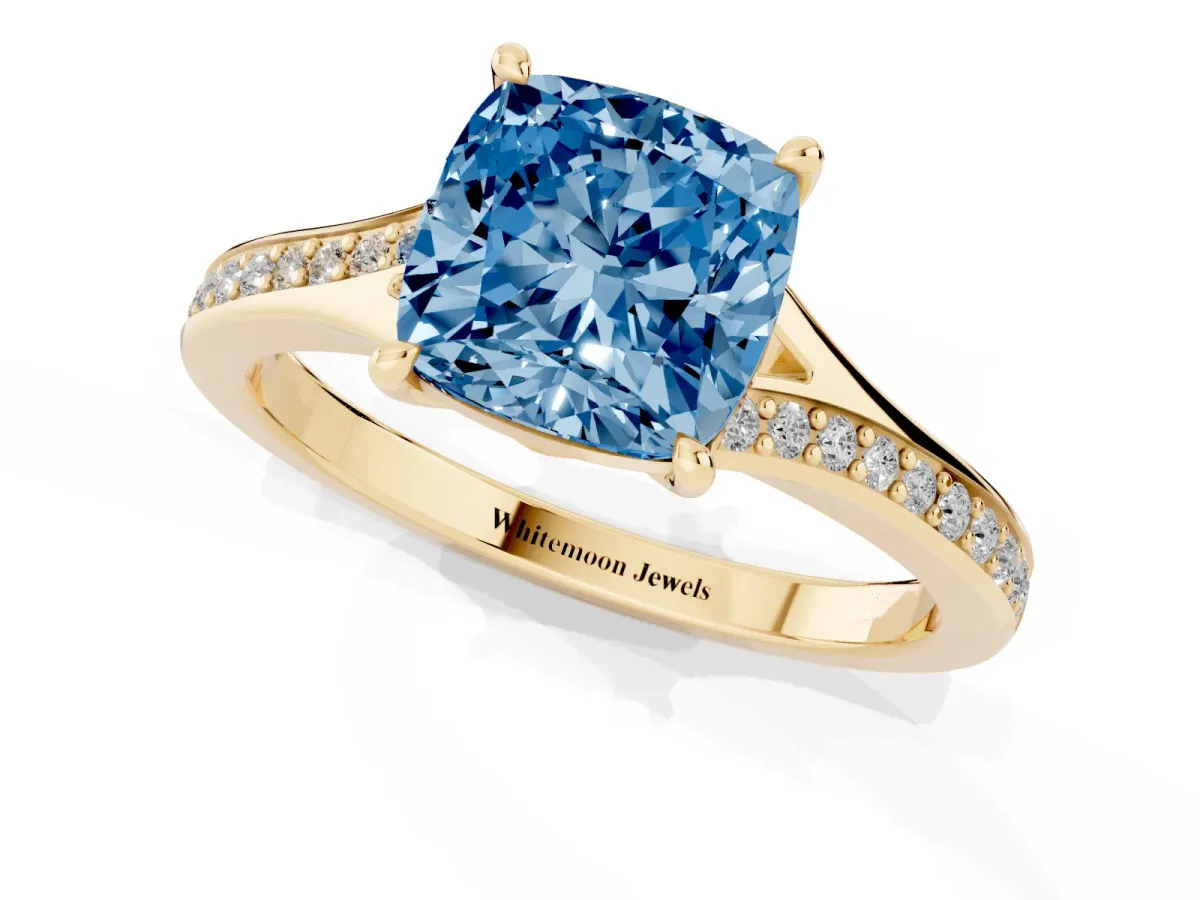 Fancy Blue Cushion Cut Diamond Solitaire Ring with Pavé Band and Prong Setting Yellow gold