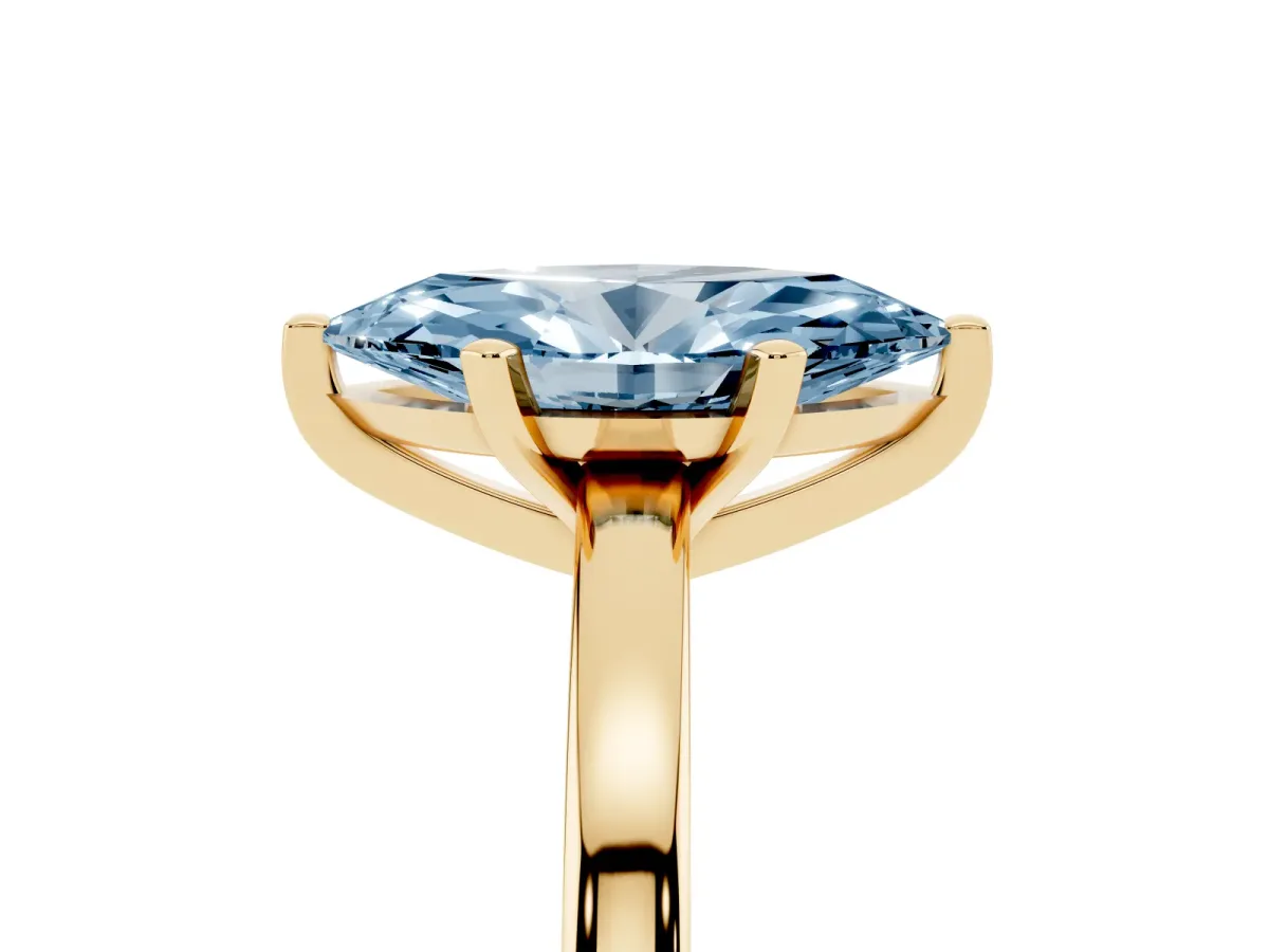Fancy Blue Marquise Cut Solitaire Diamond Engagement Ring with Four-Prong Setting on a Classic Band Yellow gold