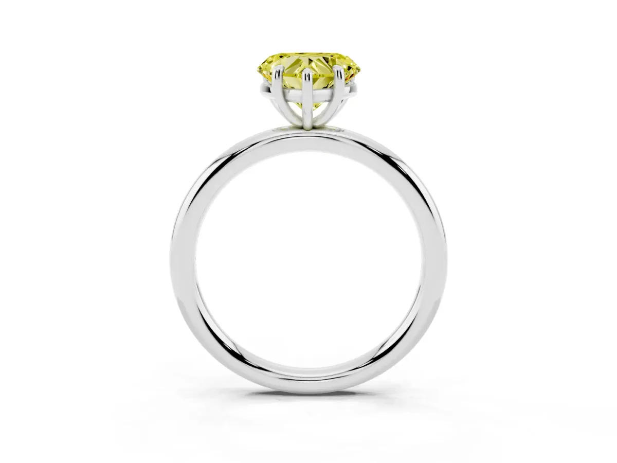 Fancy Yellow Heart Cut Solitaire Diamond Ring with Four-Prong Setting on a Plain Band Platinum