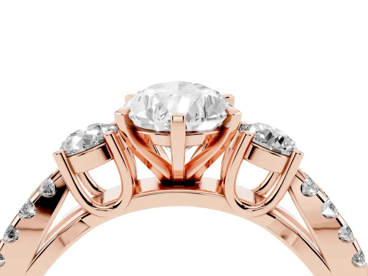 Pear Cut Diamond Three-Stone Ring with Pavé Split Shank and Four-Prong Setting Rose gold