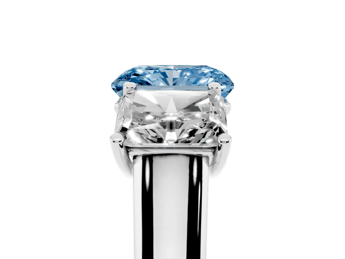 Fancy Blue Radiant Cut Three-Stone Diamond Ring with Prong Setting on a Classic Band Platinum