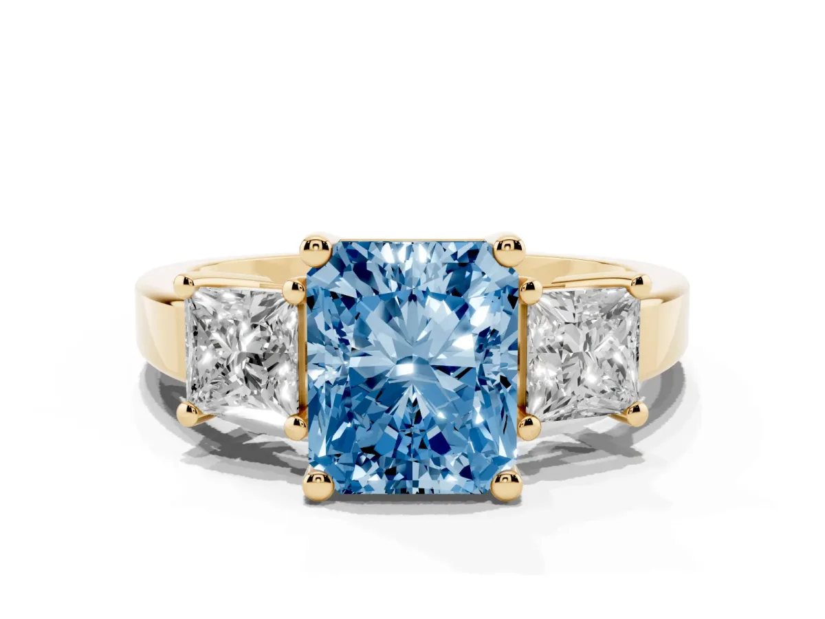 Fancy Blue Three-Stone Radiant Cut Cut Solitaire Ring with Prong Setting Yellow gold