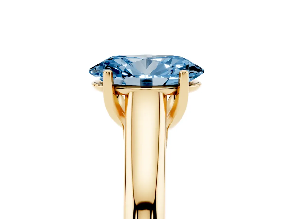 Fancy Blue Oval Cut Solitaire Engagement Ring with Tapered Band and Four-Prong Setting Yellow gold